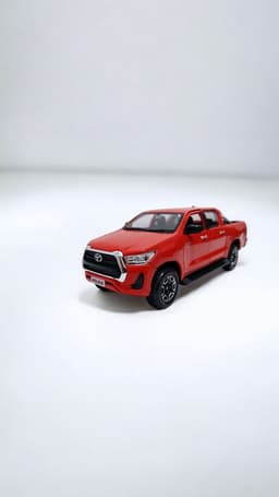 Toyota Hilux a escala 1 27 Rojo
